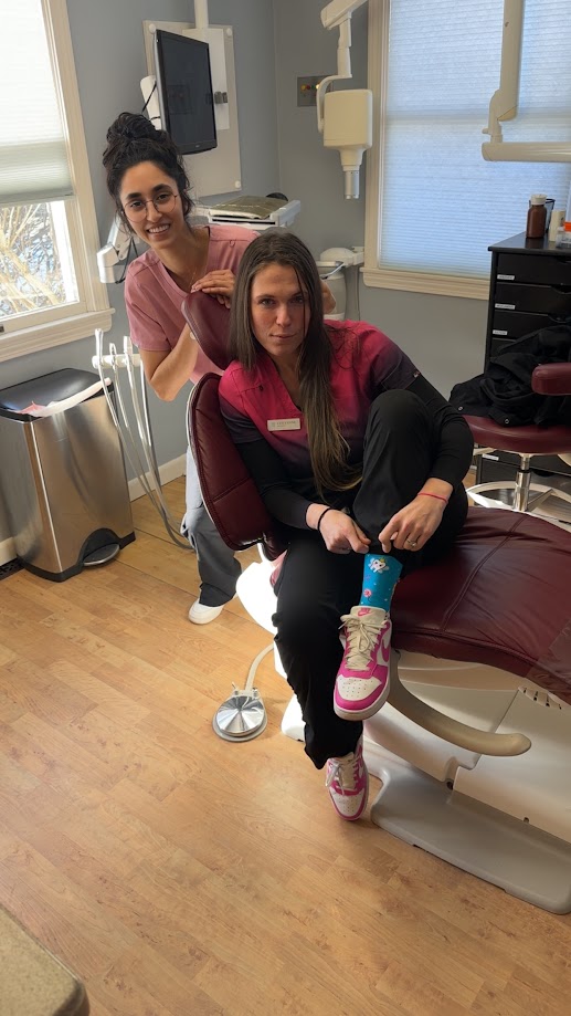 Dental team members posing together in a treatment room in Lunenburg